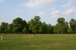 broad-leaf tree, broad-leaved tree, day, deciduous, England, eye level view, grass, group, London, park, people, picnicking, sitting, spring, sunny, The United Kingdom, tree, treeline