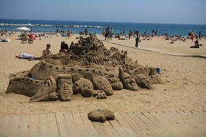 art, Barcelona, beach, Cataluña, day, direct sunlight, eye level view, group, people, sculpture, Spain, spring, summer, sunbathing, sunny