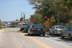 car, day, eye level view, Florida, Miami, natural light, palm, sign, street, sunny, The United States, traffic light, tropical, vegetation, winter