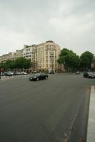 3-point perspective, architecture, building, car, day, eye level view, France, Ile-De-France, overcast, Paris, pavement, road, spring, street, transport