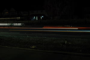 artificial lighting, car lights, city lights, England, evening, eye level view, London, night, outdoor lighting, road, The United Kingdom, urban, winter