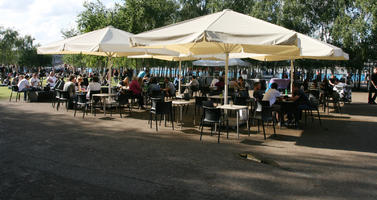 cafe, casual, chair, crowd, day, England, eye level view, family, furniture, London, people, sitting, square, summer, sunny, The United Kingdom, umbrella