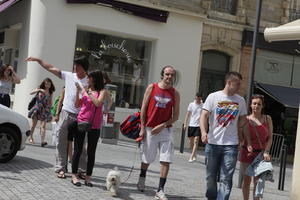 Aquitaine, Biarritz, couple, day, dog, eye level view, France, man, people, spring, street, sunlight, sunny, sunshine