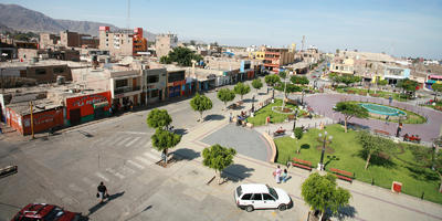 building, car, day, elevated, Ica, lamppost, natural light, Nazca, park, Peru, street, sunny, town, tree, vegetation