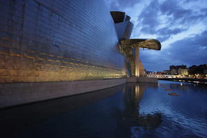 artificial lighting, Bilbao, canopy, evening, eye level view, facade, Guggenheim Museum, museum, Pais Vasco, pond, Spain