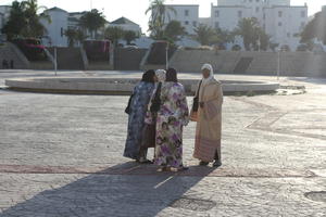 Agadir, arabic, autumn, dusk, eye level view, Morocco, square, standing, sunlight, sunny, sunshine, woman