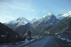 cliffs, day, eye level view, forest, mountain, nature, open space, outdoors, road, rocks, sign, snow, sunlight, sunny, Switzerland, Valais, winter