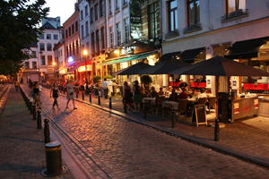 artificial lighting, Belgium, bollard, Brussels, evening, eye level view, parasol, pavement, restaurant, street, summer