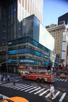 advertisement, building, couple, crossing, day, elevated, facade, fire engine, glass, man, Manhattan, New York, old, people, skyscraper, street, summer, sunny, The United States, walking