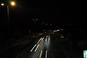 artificial lighting, car, car lights, city lights, elevated, England, evening, London, night, outdoor lighting, road, The United Kingdom, traffic, urban, winter