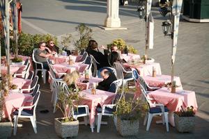 cafe, casual, caucasian, chair, day, elevated, furniture, Italia , object, people, potted plant, sitting, table, vegetation, Veneto, Venice, winter