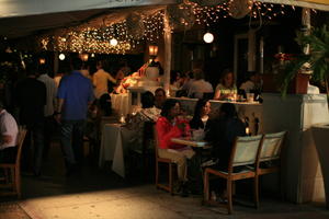 afrocarribean, artificial lighting, bar, cafe, chair, eye level view, Florida, furniture, Miami, night, people, sitting, table, The United States, walking, winter