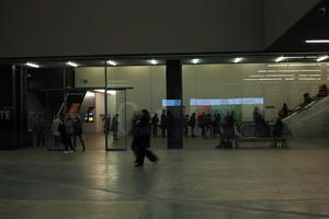 artificial lighting, England, eye level view, group, indoor lighting, indoors, interior, London, pavement, people, standing, The United Kingdom, walking