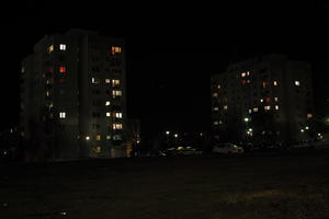 artificial lighting, building, city lights, eye level view, Kalisz, night, outdoor lighting, Poland, residential, street, urban, wet, Wielkopolskie, winter