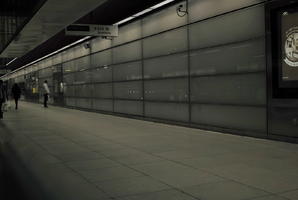 artificial lighting, England, eye level view, London, night, pavement, station, The United Kingdom, wall