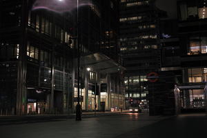 artificial lighting, building, building, city, cityscape, England, entrance, eye level view, London, night, office, pavement, plaza, sidewalk, The United Kingdom, winter