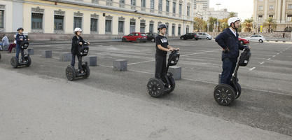 autumn, Barcelona, Cataluña, day, diffuse, diffused light, eye level view, group, people, riding, segway, Spain, street