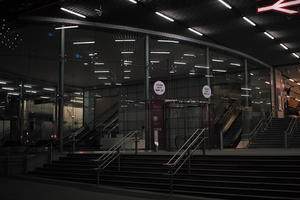 artificial lighting, building, building, England, eye level view, lobby, London, night, spring, station, steps, The United Kingdom, urban