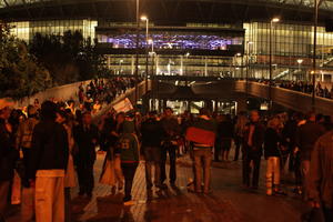 artificial lighting, crowd, England, eye level view, London, night, people, stadium, The United Kingdom