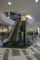 artificial lighting, Bulgaria, escalator, eye level view, group, indoor lighting, interior, people, shopping centre, summer, Varna