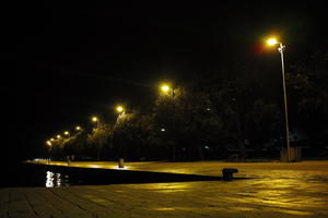 artificial lighting, Croatia, eye level view, night, park, pavement, pavement, paving, promenade, spring, street light, treeline, wet, Zadar, Zadarska