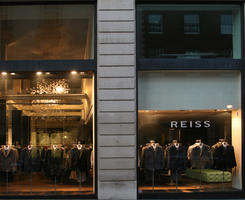 artificial lighting, England, evening, eye level view, London, mannequin, night, outdoor lighting, retail, shop, shopfronts, sign, The United Kingdom