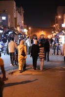 arabic, artificial lighting, autumn, crowd, Essaouira, eye level view, market, Morocco, night, people, walking, woman