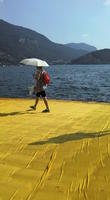 casual, day, eye level view, female, Italia , lake, Lombardia, Monte Isola, mountain, platform, side, summer, sunny, walking, woman