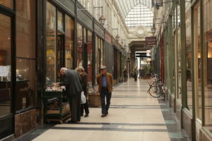 autumn, day, diffuse, diffused light, elderly, eye level view, France, group, Ile-De-France, natural light, Paris, people, retail, shopfronts, shopping centre, standing