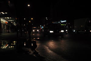 artificial lighting, car, city lights, England, eye level view, London, night, spring, street, The United Kingdom, traffic, urban