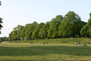 broad-leaf tree, broad-leaved tree, day, deciduous, England, eye level view, grass, group, London, park, people, picnicking, sitting, spring, sunny, The United Kingdom, tree, treeline