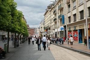 Amiens, bench, couple, day, eye level view, facade, France, group, man, overcast, people, Picardie, retail, shop, shopping, street, tree, walking