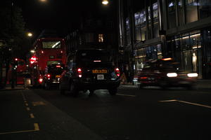 artificial lighting, car, city lights, England, eye level view, London, night, outdoor lighting, street, taxi, The United Kingdom