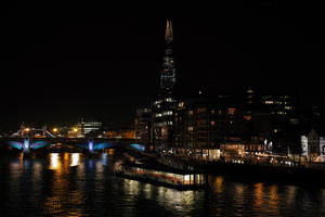 artificial lighting, boat, bridge, city, city lights, England, eye level view, London, night, outdoor lighting, reflected, river, Shard, The United Kingdom, urban