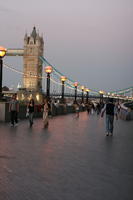 artificial lighting, diffuse, diffused light, England, evening, eye level view, group, lamppost, London, people, spring, The United Kingdom, Tower Bridge, twilight, walking