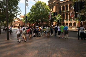 Australia, back, child, couple, day, eye level view, group, New South Wales, pavement, standing, summer, sunny, Sydney, tourist, tree, vegetation, walking