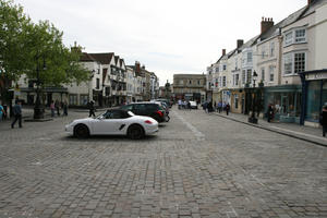 car, car park, day, diffuse, diffused light, England, eye level view, natural light, pavement, spring, street, The United Kingdom, Wells