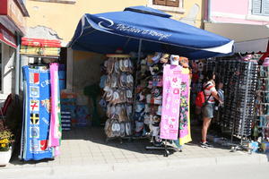 Croatia, day, display, eye level view, Istarska, natural light, object, parasol, people, shopping, spring, stall, street, summer, sunny, woman