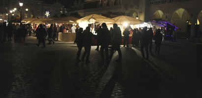 artificial lighting, crowd, eye level view, Krakow, Malopolskie, market, night, pavement, people, Poland, square, winter