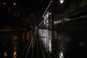 artificial lighting, city lights, eye level view, Kalisz, lowered, night, outdoor lighting, pavement, Poland, street, urban, wet, Wielkopolskie, winter