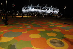 artificial lighting, England, eye level view, London, night, outdoor lighting, pavement, square, stadium, summer, The United Kingdom