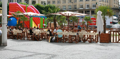 Amiens, cafe, chair, day, eye level view, France, furniture, group, overcast, palm, parasol, people, Picardie, potted plant, sitting, square, table