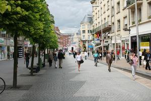 Amiens, bench, day, eye level view, France, group, man, overcast, pavement, people, Picardie, retail, shop, shopping, street, tree, walking, woman