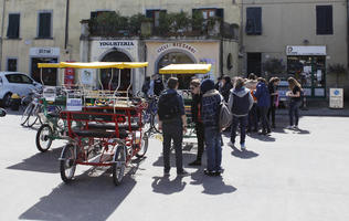 bicycle, casual, day, eye level view, group, people, queuing, spring, standing, street, sunny, tourist