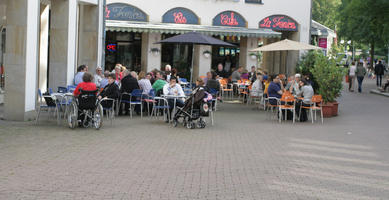 autumn, Bielefeld, bright, cafe, casual, chair, day, Deutschland, eye level view, furniture, Nordrhein-Westfalen, people, shady, sitting, street, umbrella