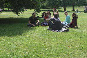 casual, day, England, eye level view, grass, group, London, park, people, shady, sitting, summer, sunny, The United Kingdom