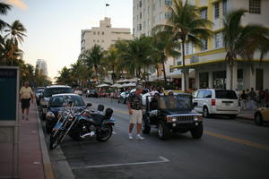 building, cafe, car, dusk, eye level view, Florida, jeep, man, Miami, motorcycle, palm, people, street, summer, The United States, transport, tree, urban, vegetation, walking, winter