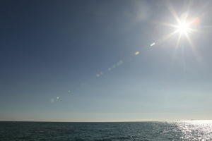 autumn, Barcelona, bright, Cataluña, clear, day, eye level view, seascape, sky, Spain, sun, sun glare, sunny, water, waves