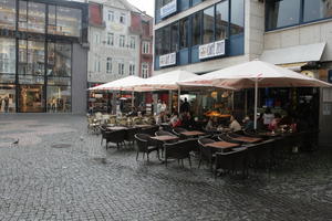 afternoon, Braunschweig, cafe, chair, day, Deutschland, eye level view, furniture, group, natural light, Niedersachsen, parasol, pavement, people, sitting, summer, table