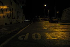 artificial lighting, car, city, Croatia, eye level view, ferry, night, spring, street, wet, Zadar, Zadarska